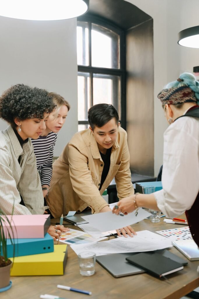 Delegation 101: Why Doing It All Yourself Is Holding Your Team Back Showing a colleague how the work is done